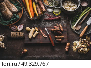 Jerusalem artichoke peeling preparation on rustic kitchen table with pot, diced vegetables, oil and ingredients, top view. Healthy and clean seasonal food cooking and eating concept. Стоковое фото, агентство Ingram Publishing / Фотобанк Лори