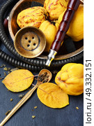 Nargile with quince. Smoking smoking hookah in Arabic style with the tobacco aroma of ripe quince. Стоковое фото, агентство Ingram Publishing / Фотобанк Лори