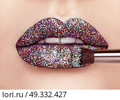 Close up view of Beautiful Woman Lips with Colorful Lipstick. Open Mouth with white Teeth. Cosmetology, drugstore or Fashion Makeup Concept.  Beauty studio shot. Passionate Kiss. Стоковое фото, агентство Ingram Publishing / Фотобанк Лори
