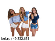 Thee teen best friends girls happy together on white background. Стоковое фото, агентство Ingram Publishing / Фотобанк Лори