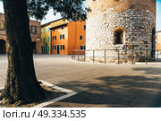 Belltower Duomo Santo Stefano on the seacoast coast in Caorle Italy. Стоковое фото, агентство Ingram Publishing / Фотобанк Лори