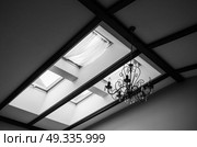 skylights in the roof of the house with a vintage chandelier on the ceiling. Стоковое фото, агентство Ingram Publishing / Фотобанк Лори