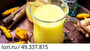 Turmeric Golden milk. Turmeric Golden milk in a glass cup. Стоковое фото, агентство Ingram Publishing / Фотобанк Лори