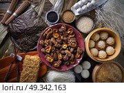 Shiitake rice dumplings steamed pork buns noodles Asian cuisine food mix. Стоковое фото, агентство Ingram Publishing / Фотобанк Лори