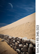Tourists travel through the dunes in the Atacama Desert. Oasis of Huacachina, Peru, South America. moon shines. Стоковое фото, агентство Ingram Publishing / Фотобанк Лори