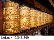Prayer wheels at Swayambhunath stupa in Kathmandu, Nepal. Стоковое фото, агентство Ingram Publishing / Фотобанк Лори