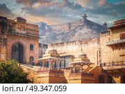 Amber Fort or Amer - fortified residence of Raja in the eponymous northern suburbs of Jaipur, on the crest of a rocky hill behind the lake Maota. Стоковое фото, агентство Ingram Publishing / Фотобанк Лори