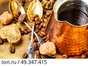 Coffee with sweets. Coffee cezve and beans of Turkish coffee and luxury sweets. Стоковое фото, агентство Ingram Publishing / Фотобанк Лори