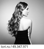 Portrait of beautiful blonde woman in green dress. Portrait of beautiful blonde woman in green dress. Fashion photo. Long Hair. Стоковое фото, агентство Ingram Publishing / Фотобанк Лори