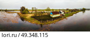 Spring melting river flood aerial panorama. Overflow water at springtime. Drone spate view. Spill landscape.. Spring melting river flood aerial panorama. Overflow water at sp. Стоковое фото, агентство Ingram Publishing / Фотобанк Лори