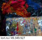 Colorful wood board and dirty fabrics of printing. Colorful wood board and dirty fabrics in a printing factory at the cleaning area. Стоковое фото, агентство Ingram Publishing / Фотобанк Лори