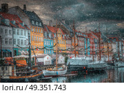 there is snow in the winter. Nyhavn is the old harbor of Copenhagen. Denmark. Nyhavn is the old harbor of Copenhagen. Стоковое фото, агентство Ingram Publishing / Фотобанк Лори