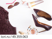 Fashion Christmas flat lay scene. Fashion flat lay scene. Hight heel shoes, lacy dress, dressing up for party, frame of fashion accessoires. Стоковое фото, агентство Ingram Publishing / Фотобанк Лори