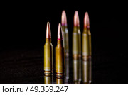 Ammunition cartridges on black background. Ammunition cartridges on black. Стоковое фото, агентство Ingram Publishing / Фотобанк Лори