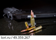 Ammunition cartridges on black background. Ammunition cartridges. Стоковое фото, агентство Ingram Publishing / Фотобанк Лори