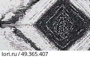 Abstract black and white halftone pattern with a diamond shape and scattered dots. The design creates a sense of depth and movement. Стоковое AI-видео, аниматор Ольга Невская / Фотобанк Лори