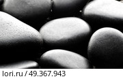 Black pebbles background backlite. Black pebbles background. Стоковое фото, агентство Ingram Publishing / Фотобанк Лори