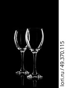 transparent glass for brandy or cognac on black background with reflection. Стоковое фото, агентство Ingram Publishing / Фотобанк Лори
