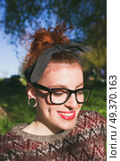 Cute and redhead nerdy girl . Стоковое фото, агентство Ingram Publishing / Фотобанк Лори