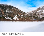 Panticosa snow frozen lake ice in Huesca Pyrenees of Spain. Стоковое фото, агентство Ingram Publishing / Фотобанк Лори