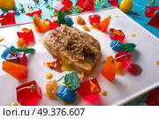 Foie slice with grated white truffle and colorful jelly decoration. Стоковое фото, агентство Ingram Publishing / Фотобанк Лори