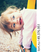 Little girl playing at the park . Стоковое фото, агентство Ingram Publishing / Фотобанк Лори