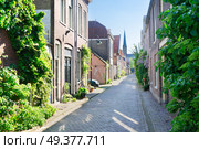 small street in Delft old town in Holland. Delft old town in Holland. Стоковое фото, агентство Ingram Publishing / Фотобанк Лори