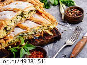 Homemade pie with egg, spinach and onion stuffing. Pie with green and eggs. Стоковое фото, агентство Ingram Publishing / Фотобанк Лори