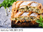 Homemade pie with egg, spinach and onion stuffing. Pie with green and eggs. Стоковое фото, агентство Ingram Publishing / Фотобанк Лори