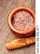 Grinded rhizomes of plant iris in mortar.Herbal medicine.Herbalism. Grinded rhizomes of iris. Стоковое фото, агентство Ingram Publishing / Фотобанк Лори