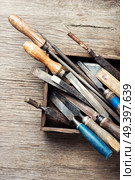 Old vintage hand tools on wooden background. Retro carpenter tool. Стоковое фото, агентство Ingram Publishing / Фотобанк Лори