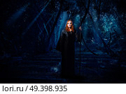 Young witch in night forest. Стоковое фото, агентство Ingram Publishing / Фотобанк Лори