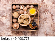 Diet candy for immunity from dried apricots, sesame, nuts, raisins and prunes with honey. Dietary candy for immunity. Стоковое фото, агентство Ingram Publishing / Фотобанк Лори