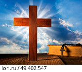 Christian wood cross on blue sky wooden made with Bible and rosary beads. Стоковое фото, агентство Ingram Publishing / Фотобанк Лори