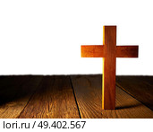 Christian wood cross on white and wooden background. Стоковое фото, агентство Ingram Publishing / Фотобанк Лори
