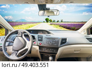 car windscreen with country summer road, view inside out. car windscreen with road. Стоковое фото, агентство Ingram Publishing / Фотобанк Лори