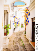 Poble Espanyol street, with traditional for Andalusia white walls, Barcelona, Catalonia Spain, toned. Poble Espanyol, Barcelona. Стоковое фото, агентство Ingram Publishing / Фотобанк Лори
