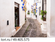 Poble Espanyol street, with traditional for Andalusia white walls, Barcelona, Catalonia Spain. Poble Espanyol, Barcelona. Стоковое фото, агентство Ingram Publishing / Фотобанк Лори