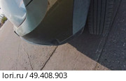 A car with a black bumper and a tire with a white stripe. Стоковое видео, видеограф Ярославский Максим / Фотобанк Лори