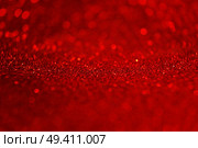An amazing and beautiful macro of a red glow purpurin surface with glitters and depth of field. Стоковое фото, агентство Ingram Publishing / Фотобанк Лори