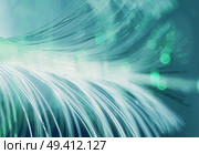 An amazing and vibrant macro of green fiber optical pipes that illuminate making sparkles and glitters with black background. Стоковое фото, агентство Ingram Publishing / Фотобанк Лори