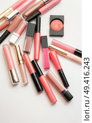 lipgloss in assortiment around white backround. Стоковое фото, агентство Ingram Publishing / Фотобанк Лори