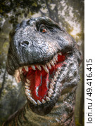 dinosaur tyrannosaurus rex growls in the forest. Стоковое фото, агентство Ingram Publishing / Фотобанк Лори