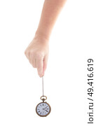 time concept - someones hand holding antique clock isolated on white background. Стоковое фото, агентство Ingram Publishing / Фотобанк Лори