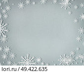 Snowflakes frame on cold gray background with copy space, top view. Christmas and winter holiday concept. Стоковое фото, агентство Ingram Publishing / Фотобанк Лори