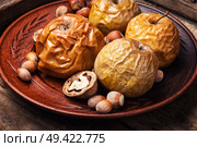 Fruit dessert baked apples with nut.Delicious sweet food. Baked apples with nuts. Стоковое фото, агентство Ingram Publishing / Фотобанк Лори