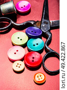 Bright assorted sewing buttons in mix colors. Set of tailoring accessories. Стоковое фото, агентство Ingram Publishing / Фотобанк Лори