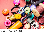 Bright assorted sewing buttons in mix colors. Set of tailoring accessories. Стоковое фото, агентство Ingram Publishing / Фотобанк Лори