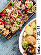 Beef shish kebab.Bbq meat on wooden skewers.Eastern food. Shish kebab or shashlik. Стоковое фото, агентство Ingram Publishing / Фотобанк Лори
