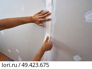 laminated plasterboard plastering join tape DIY detail. Стоковое фото, агентство Ingram Publishing / Фотобанк Лори